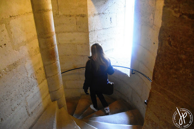 woman going down spiral staircase