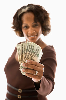 woman with money; black woman