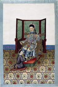 Chinese nobleman on throne and attendant