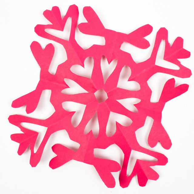 make paper heart snowflakes for Valentine's Day- such a fun kids craft idea!