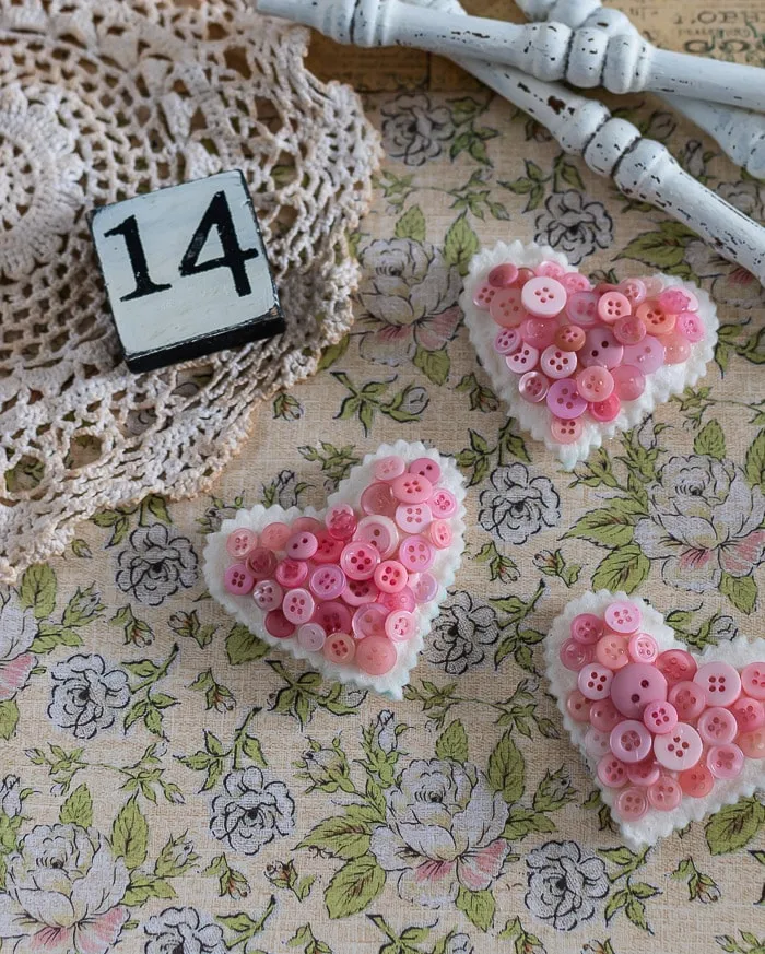 chippy white spindles, vintage doily, pink button hearts