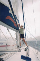 Vicky bringing down the sail in bad weather