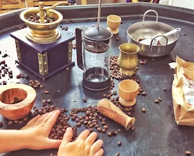 tuff tray with coffee beans, coffee grinder, egg cups and containers