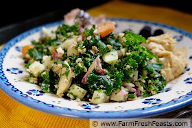 a plate of CSA farm share chopped salad with kale, purple cauliflower, kohlrabi, Hakurei turnips, bulgur, eggs and feta