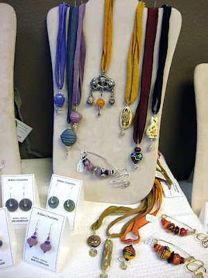 bead jewelry by Robin Atkins, featuring old silver pendants