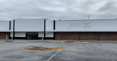 Vacant storefront with Kmart labelscar