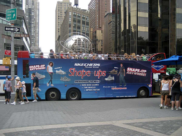 Sightseers Swing Past Earth - At Columbus Circle.