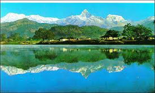 Fishtail Mountain and shadow in Fewa Lake Picture.