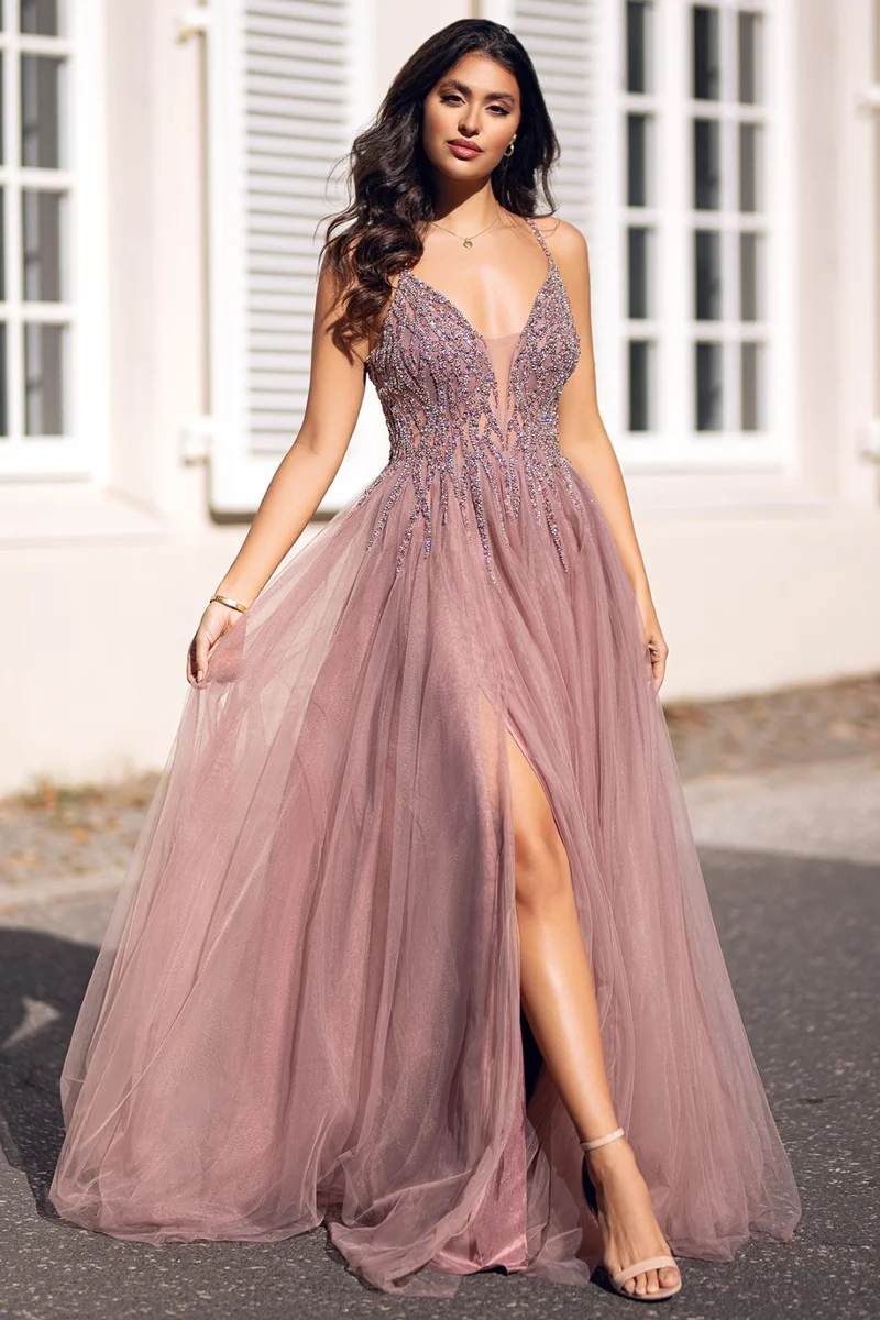 beautiful woman in a pink floor-lenght homecoming dress