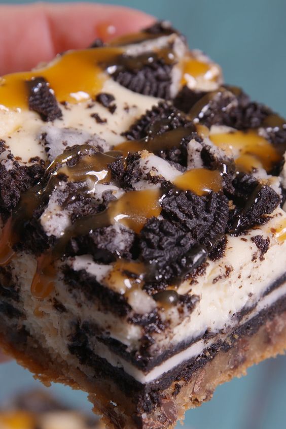 These will definitely get around. Called "Slutty Cheesecake Bars. Choc chip dough, oreos, cheesecake mixture, more oreos, warm caramel. 