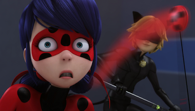 Ladybug looking disconcerted as she whirls her yo-yo, with Cat Noir in the background.