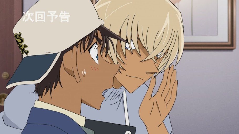 Amuro whispers to a surprised Heiji