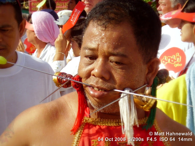 Thailand, Phuket, Vegetarian Festival, Tesagan Jia Chai, Nine Emperor Gods Festival, Taoist celebration, Thai Chinese man, mah song, street portrait, self-mutilation, piercing, impaling, ritualised mutilation