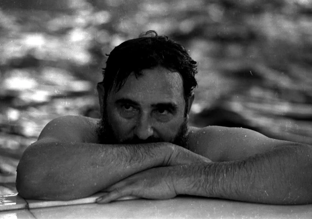 Image Attribute:  Then Cuban Prime Minister Fidel Castro relaxes in a swimming pool during a visit to Romania in this May 28, 1972 file photo. REUTERS/Prensa Latina/File Photo