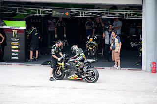 Andrea Dovizioso getting off his bike