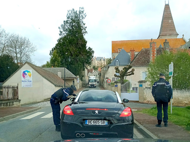 Police stopping cars for a large funeral in a village, Indre et Loire, France. Photo by Loire Valley Time Travel.