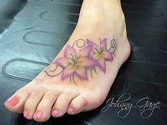 flowers on foot tattoo