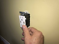 Installing the outlet into the wall