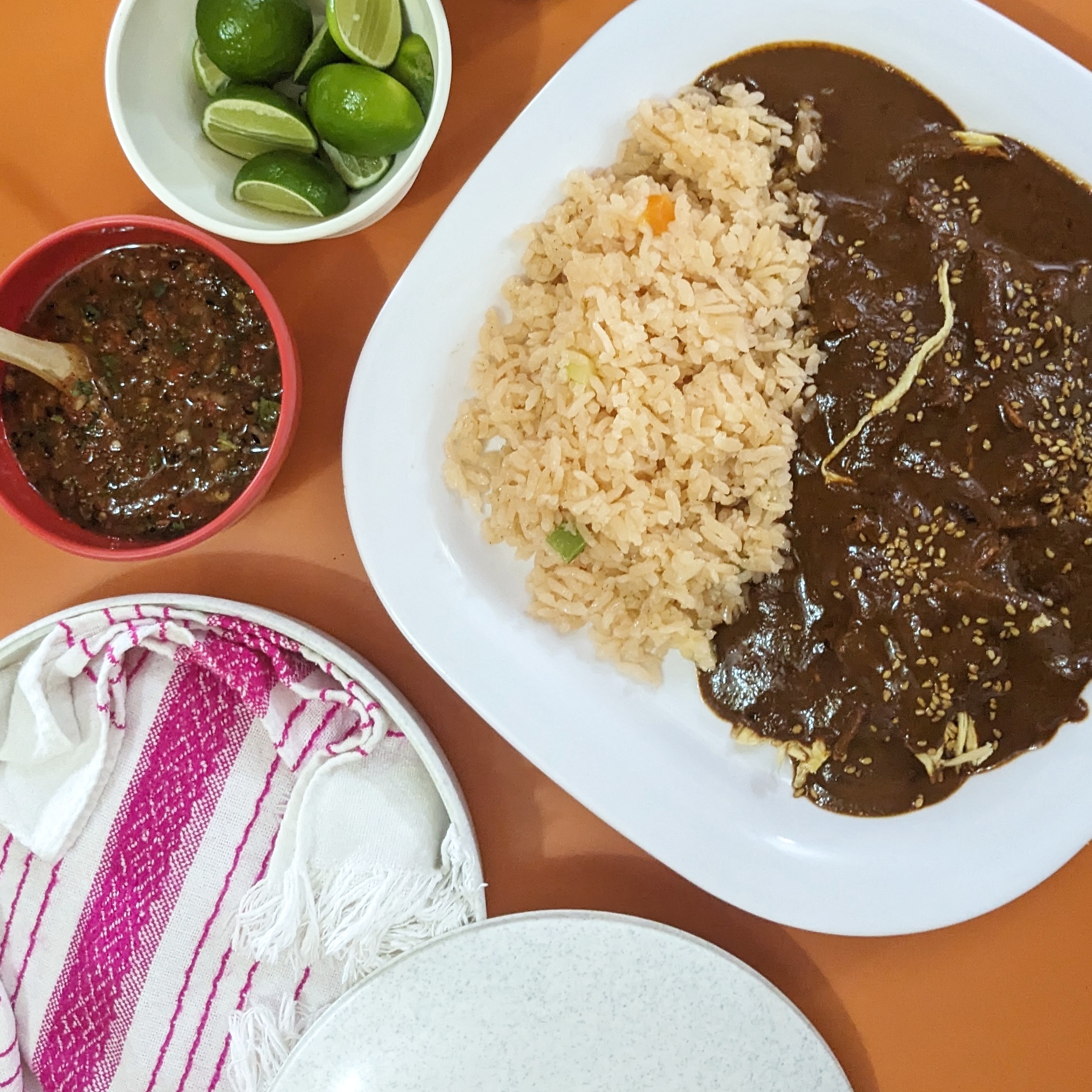 Mole, rice, lime, salsa and tortillas at Fonda Chimalistac, one of the best places to eat at in mexico city