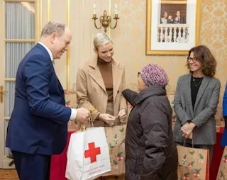 Prince Albert II and Princess Charlene of Monaco Christmas gift distribution