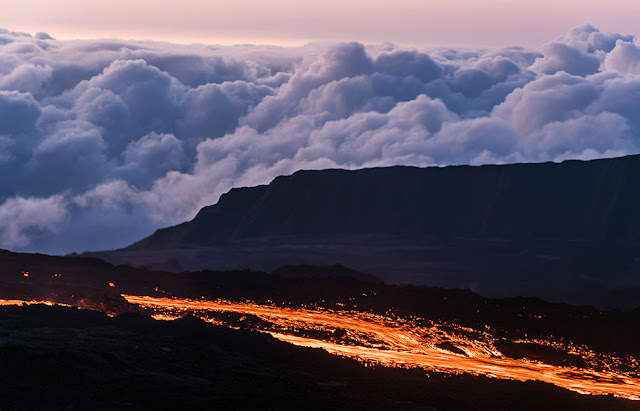 Molten lava flows from the Piton de la Fournaise, one of the world's most active volcanoes, on France's Reunion Island in the Indian Ocean. | (REUTERS/Gilles Adt)