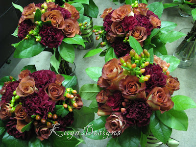 I used Leonidas roses burgundy carnations lemon leaf and hypericum 