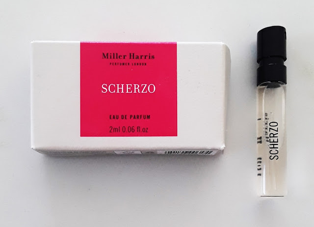 Bone and hot pink Miller Harris rectangular sample box with white and black font and 2-ml sample vial with black font and top