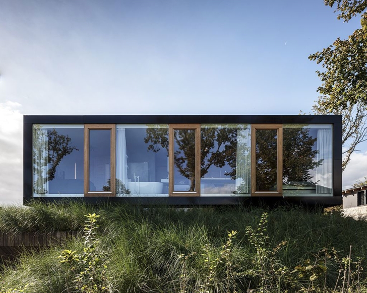 Facade of Modern Villa V by Paul de Ruiter Architects from the street