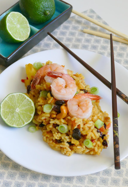 This easy 30 minute Shrimp Pineapple Fried Rice is delicious and such a great way to use leftover rice! This Thai inspired recipe gets it's flavors from pineapple, nuts, curry and raisins, along with vegetables and shrimp. Also great with chicken and so much better than takeout!
