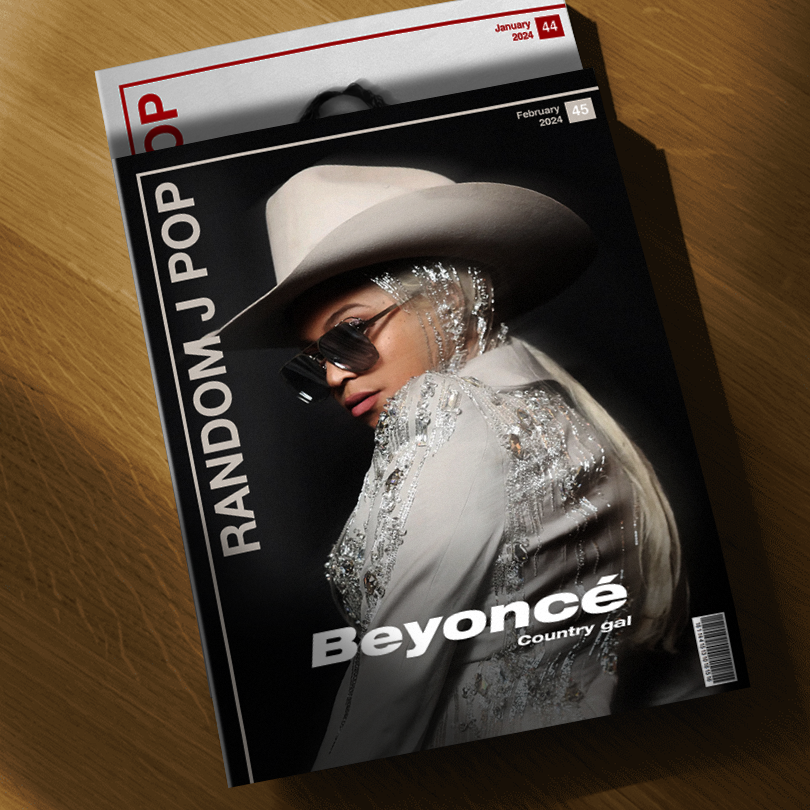 The February 2024 issue of the Random J Pop monthly. The cover features a shot of Beyoncé wearing a jewel encrusted blazer and a cowboy hat. With her hair platinum blonde and in a ponytail.