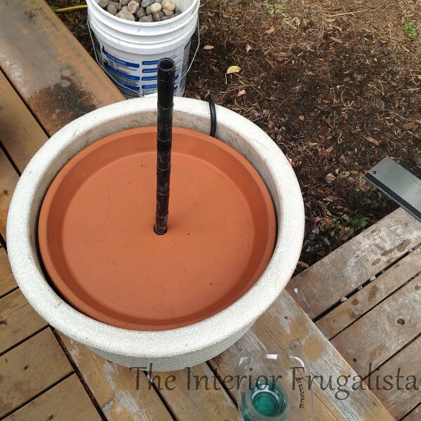 This budget-friendly DIY Plant Pot Water Fountain is the perfect water feature for a deck, patio, porch, or balcony using a trio of flower pots.