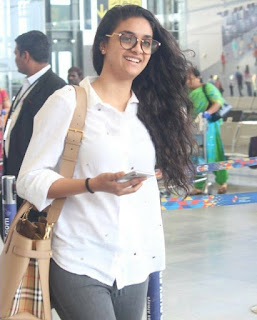 Keerthy Suresh in White Dress with Cute and Awesome Lovely Smile at Hyderabad Airport 1