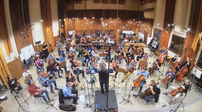 Tree Adams conducting an orchestra in Budapest