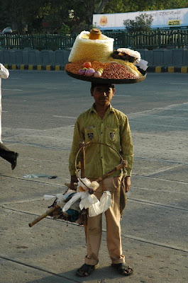 Man Carrying Load on His Head in India