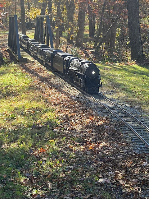 Small Train on a track going over bridge