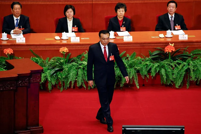 Image Attribute:  Premier Li Keqiang walks onto the stage to give a government work report during the opening session of the National People's Congress (NPC) at the Great Hall of the People in Beijing, China, March 5, 2017. REUTERS/Damir Sagolj