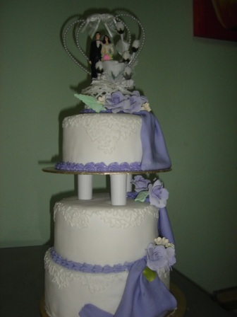 Martina 3 tier wedding cake with purple drape in conneli design and silver