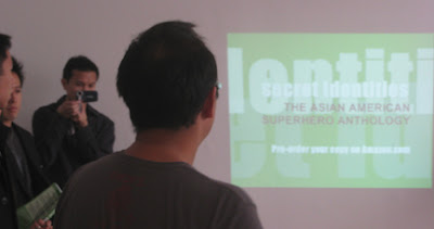 Jeff Yang gives a Secret Identities slide presentation. Photo by Giant Robot.