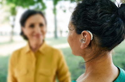 Woman wearing a hearing aid photo