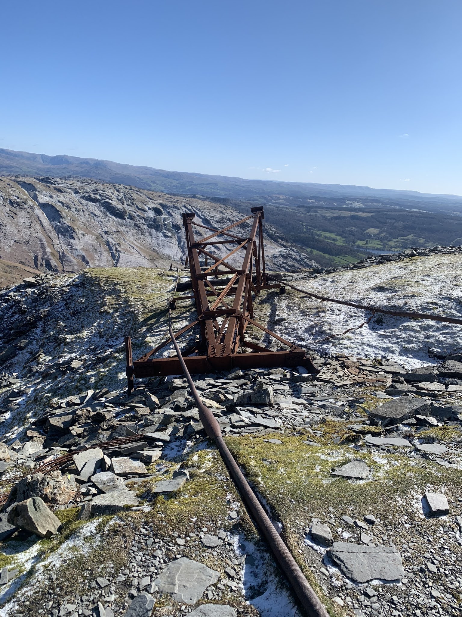 Abandoned electrical pylon that is now rusty on the hike up old man of coniston