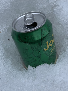 A can of Jai Alai sitting in the snow.