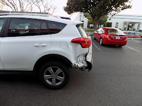 Collision damage on 2015 Toyota RAV4 before repairs at Almost Everything Auto Body.