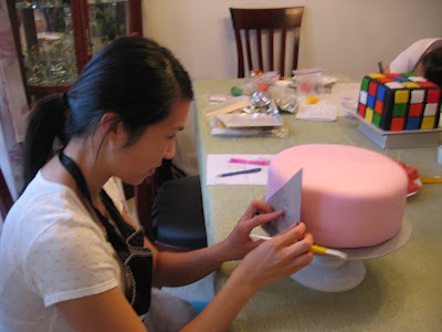 Here I am doing the quilting pattern on Jen's fondant pink cake