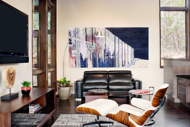 Photo of modern relaxing room with cozy chair and huge tv