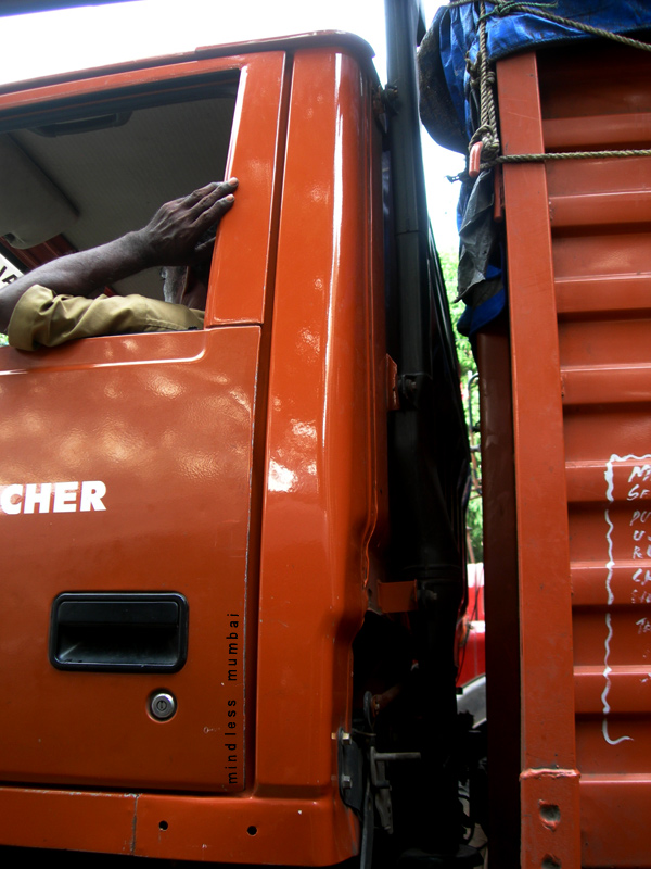 truck on a road in mumbai by kunal bhatia