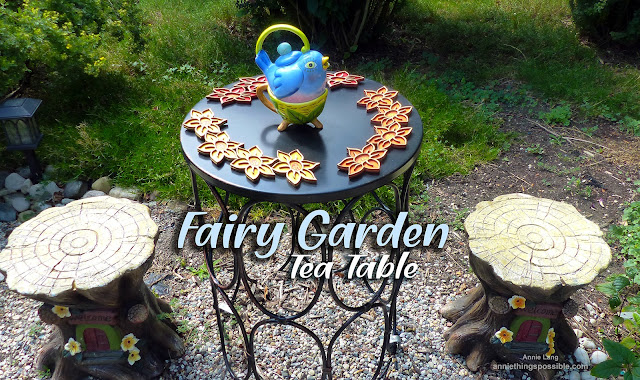 Annie Lang shows you how to decorate a Fairy Garden Tea Table with painted wooden flower swags