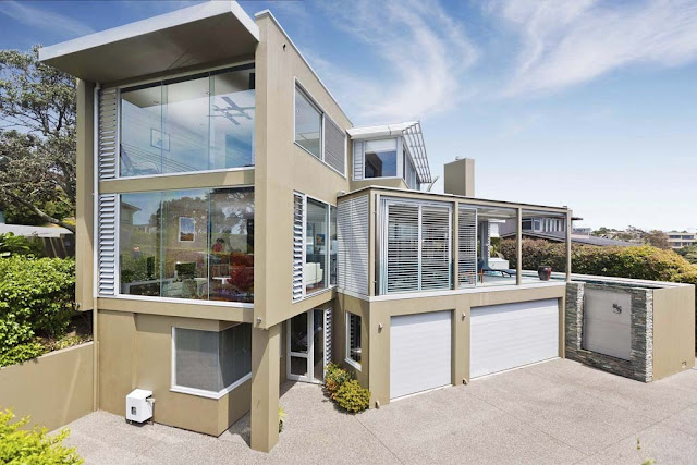 Photo of incredible modern house as seen from the air above the driveway