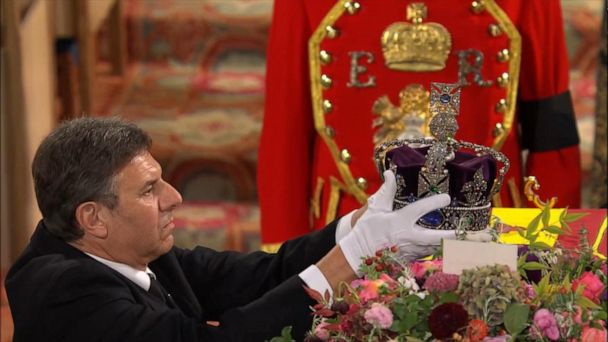 Queen’s reign ends as crown removed from coffin