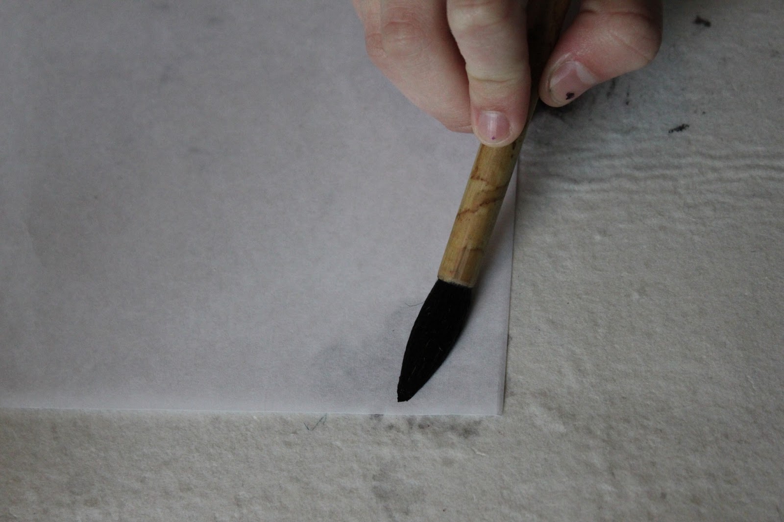 ... the brush to the paper and press down to form a slightly oval shape