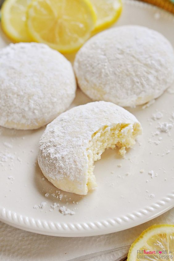 Tender, buttery Lemon Cooler Cookies are flavored with fresh lemon juice and generously coated with lemon-zest powdered sugar. Bursting with lemon!